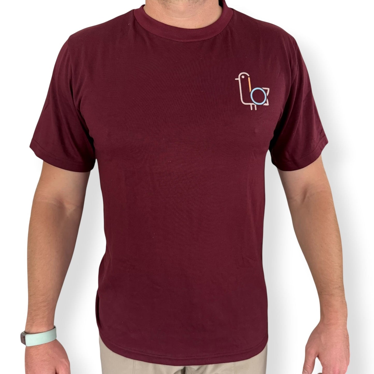 Man in a burgundy On-Brand golf t-shirt with bird logo, front – On-Brand Golf
