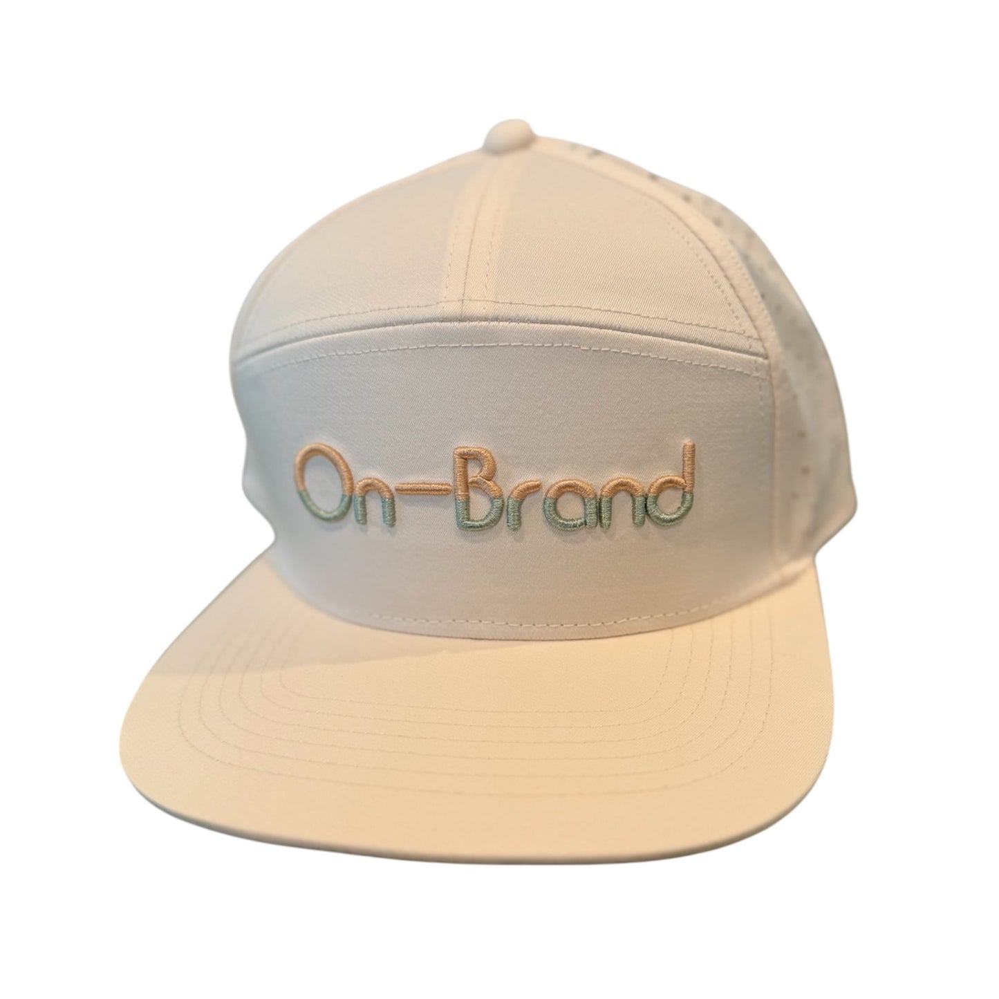 Cream On-Brand Golf cap with raised On-Brand wordmark embroidery