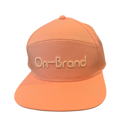Peach On-Brand Golf cap with raised On-Brand wordmark embroidery