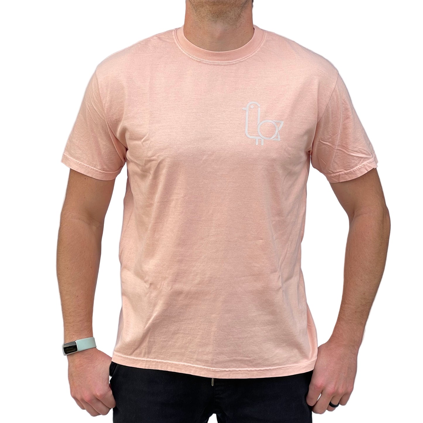 Person wearing a peach t-shirt with the On-Brand logo