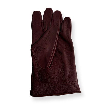 Burgundy leather golf glove, perforated palm, flat lay – On-Brand Golf
