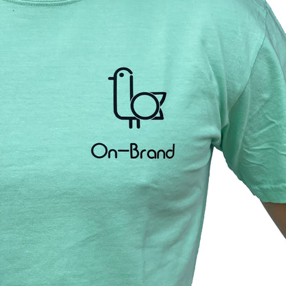 On-Brand Golf seafoam t-shirt front, close-up of black seagull and On-Brand chest print